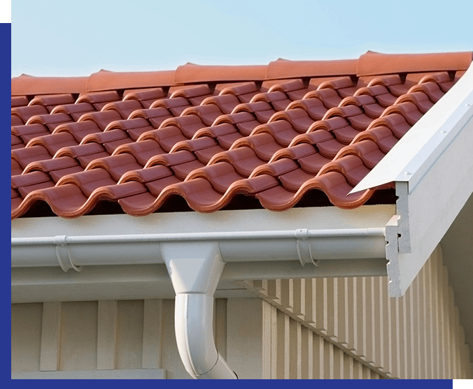 A red tile roof with gutter and rain gutters.